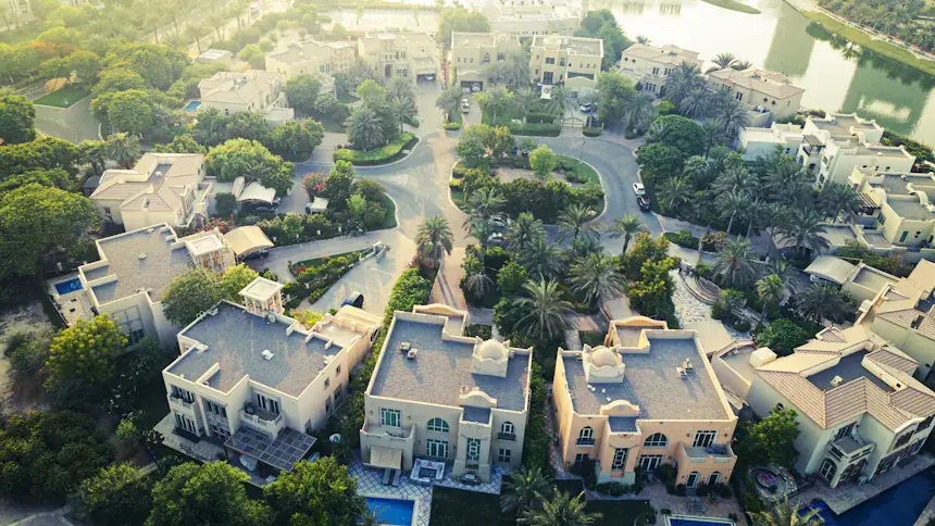 Aerial view of a low-rise residential neighbourhood of villas and townhouses in Dubai.